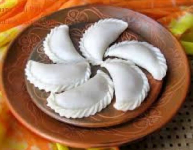 শীতে মজাদার তিলের পুলি পিঠা
